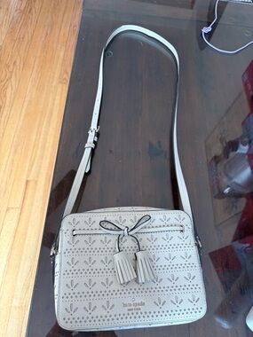 kate spade Cream Perforated Tassel Crossbody Bag